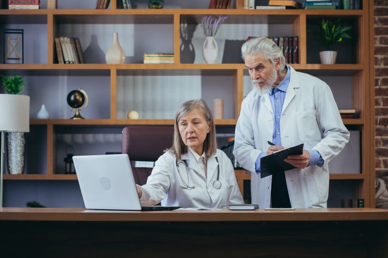 Senior doctors consult with doctor about Productivity Problems Plaguing Urgent Care Clinics