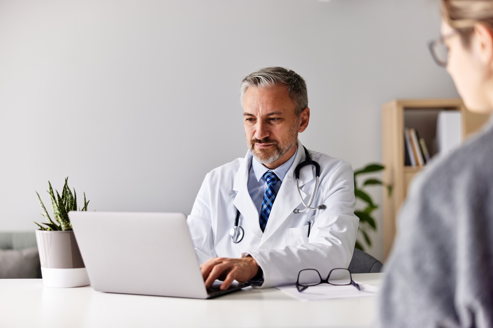 Doctor writing SOAP Notes