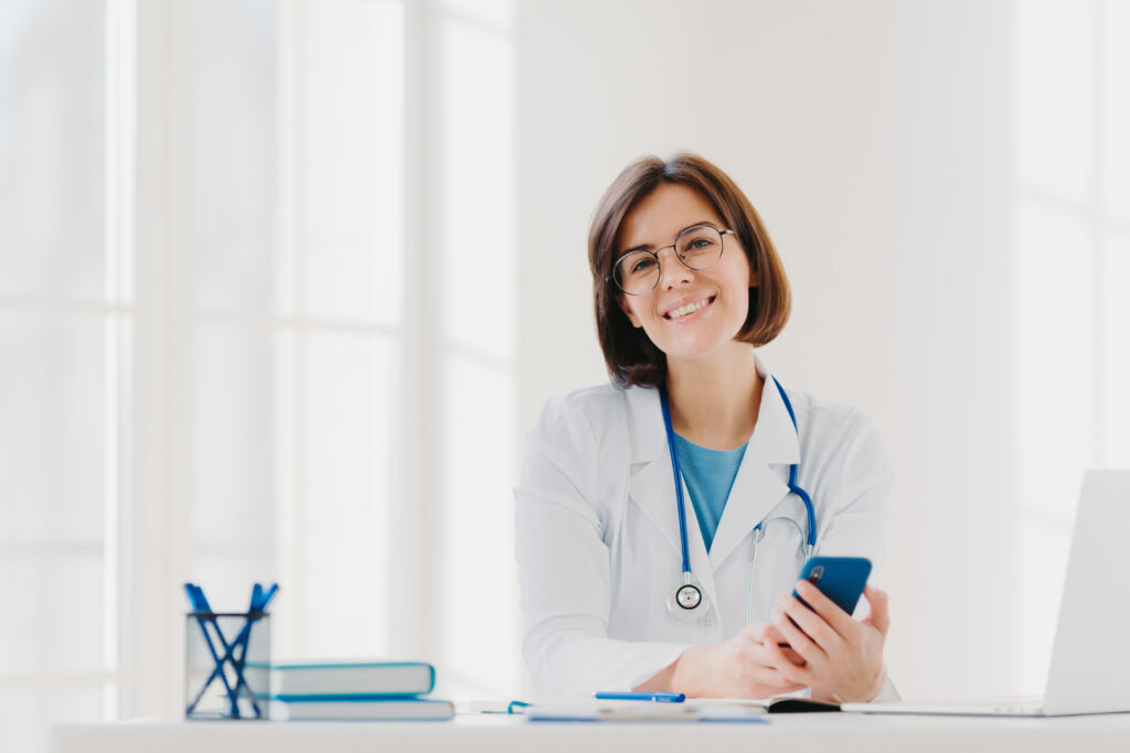 Smiling professional doctor works in clinic with automated electronic billing processes